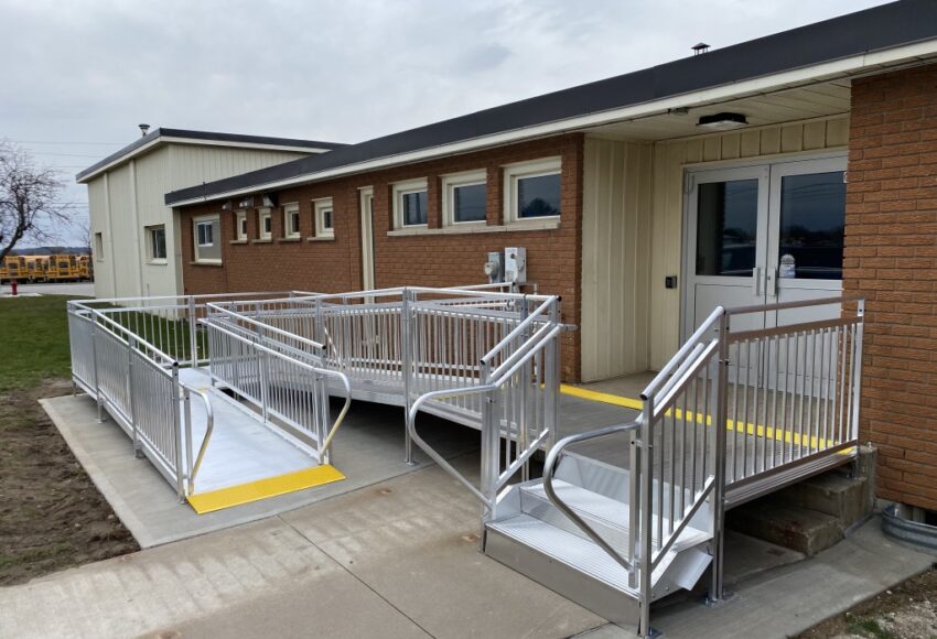 Commercial wheelchair ramp installation with handrails at Toronto business entrance – First Choice Access